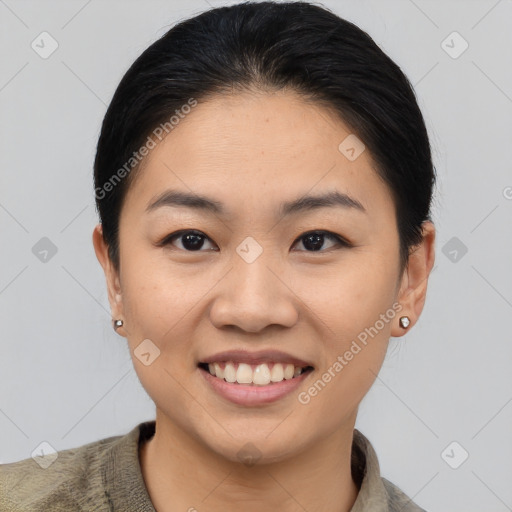 Joyful asian young-adult female with short  brown hair and brown eyes