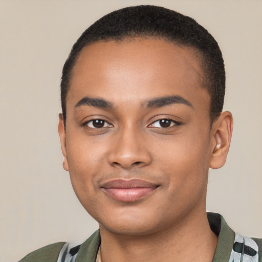 Joyful black young-adult male with short  black hair and brown eyes