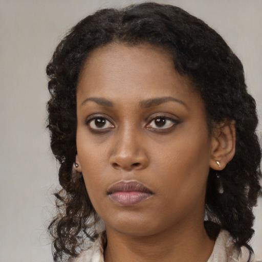 Neutral black young-adult female with medium  black hair and brown eyes