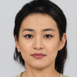 Joyful asian young-adult female with medium  black hair and brown eyes