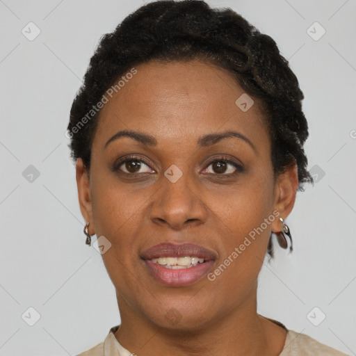 Joyful black adult female with short  brown hair and brown eyes