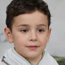 Joyful white child male with short  brown hair and brown eyes