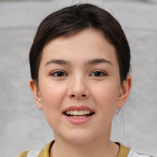 Joyful white child female with short  brown hair and brown eyes