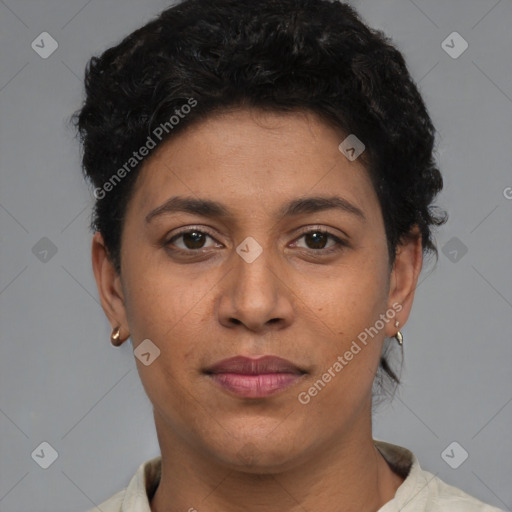 Joyful latino young-adult female with short  brown hair and brown eyes