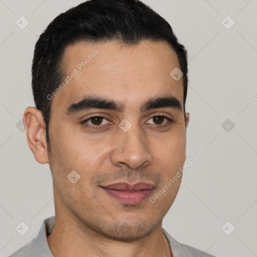 Joyful white young-adult male with short  black hair and brown eyes