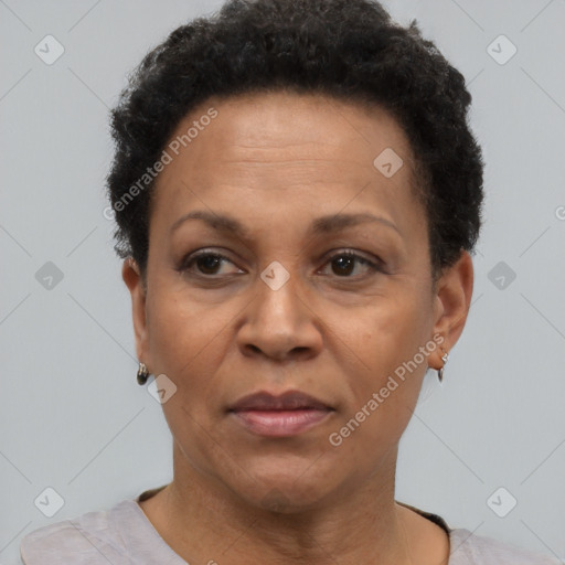 Joyful black adult female with short  brown hair and brown eyes