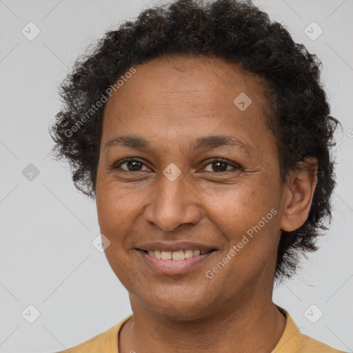 Joyful latino adult female with short  brown hair and brown eyes