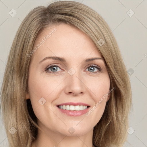 Joyful white young-adult female with long  brown hair and green eyes