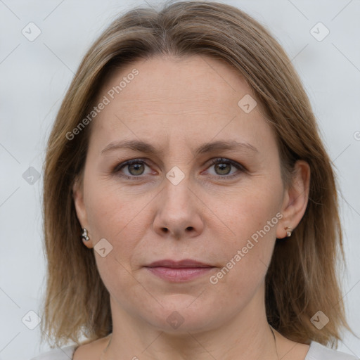 Joyful white adult female with medium  brown hair and grey eyes