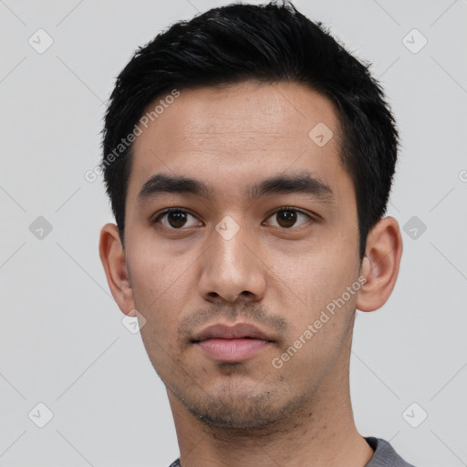 Neutral latino young-adult male with short  black hair and brown eyes