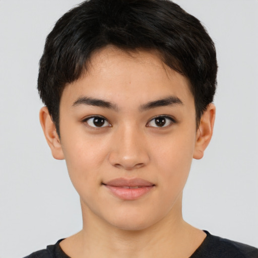 Joyful latino young-adult female with short  black hair and brown eyes