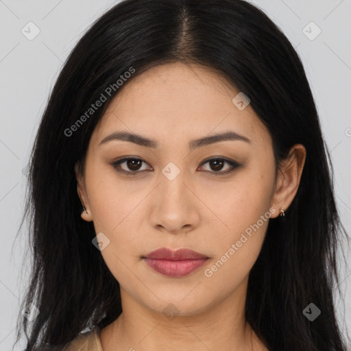 Joyful asian young-adult female with long  brown hair and brown eyes