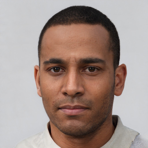 Neutral black young-adult male with short  black hair and brown eyes