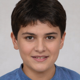 Joyful white child male with short  brown hair and brown eyes