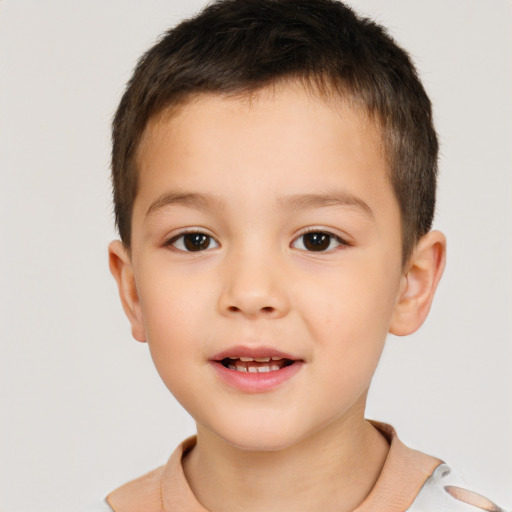 Joyful white child male with short  brown hair and brown eyes