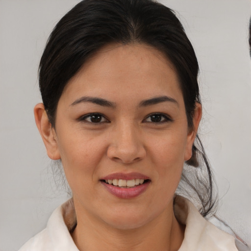 Joyful asian young-adult female with medium  brown hair and brown eyes