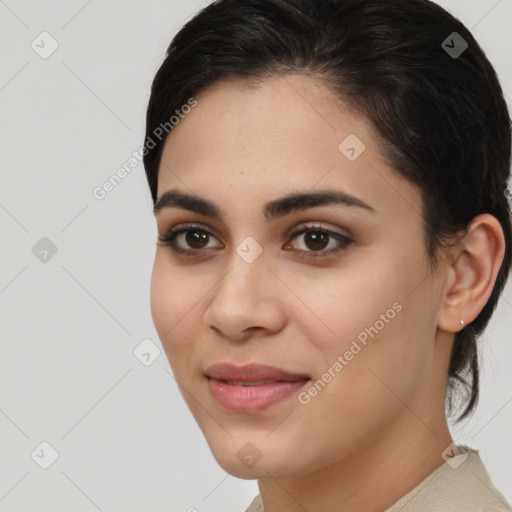 Joyful latino young-adult female with medium  brown hair and brown eyes