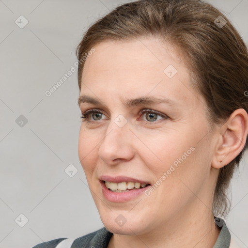 Joyful white adult female with medium  brown hair and grey eyes