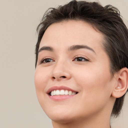 Joyful white young-adult female with medium  brown hair and brown eyes