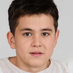 Joyful white child male with short  brown hair and brown eyes