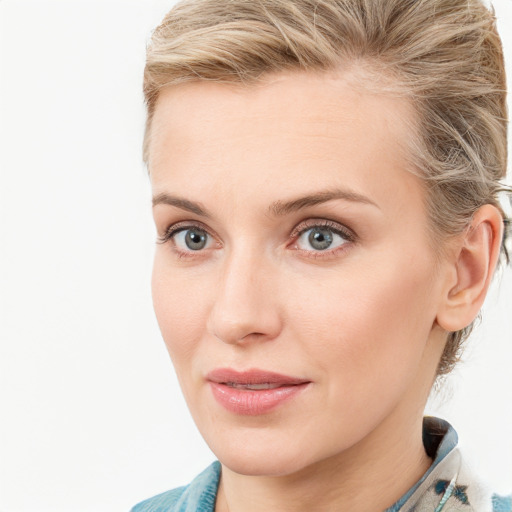 Joyful white young-adult female with medium  brown hair and blue eyes