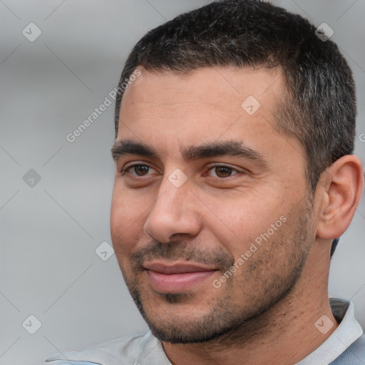 Joyful white young-adult male with short  black hair and brown eyes