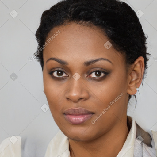 Joyful black young-adult female with short  black hair and brown eyes