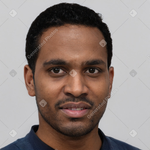 Joyful black young-adult male with short  black hair and brown eyes