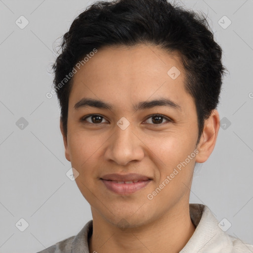 Joyful latino young-adult male with short  black hair and brown eyes