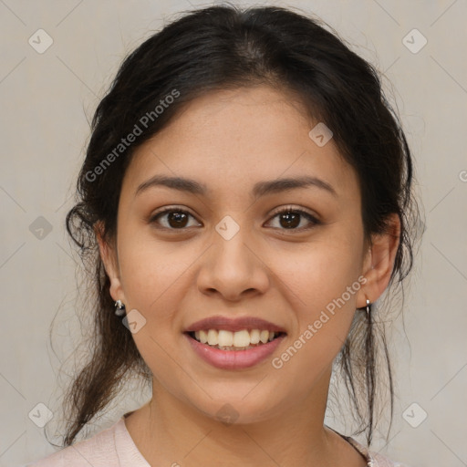 Joyful latino young-adult female with medium  brown hair and brown eyes