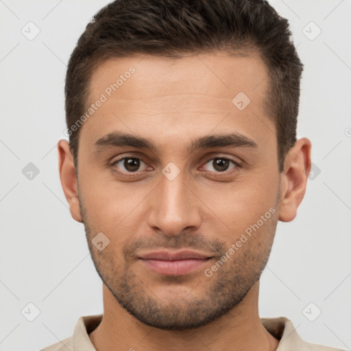 Joyful white young-adult male with short  brown hair and brown eyes