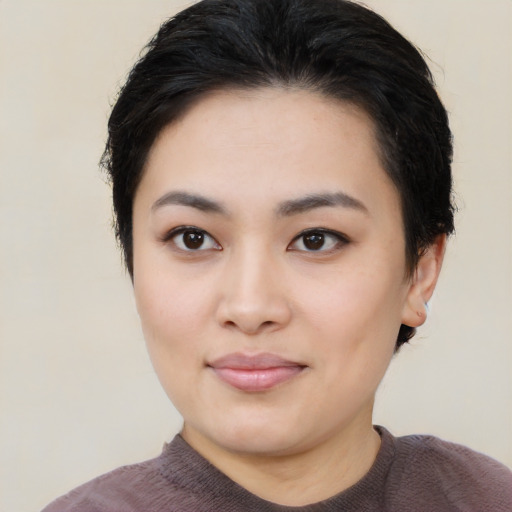 Joyful white young-adult female with medium  black hair and brown eyes