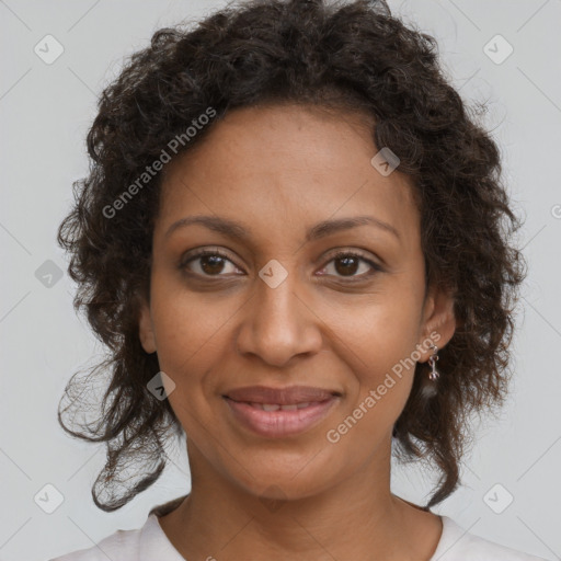 Joyful black young-adult female with medium  brown hair and brown eyes