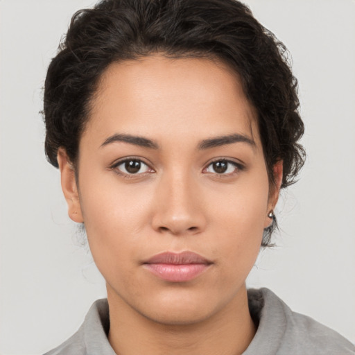 Neutral white young-adult female with short  brown hair and brown eyes