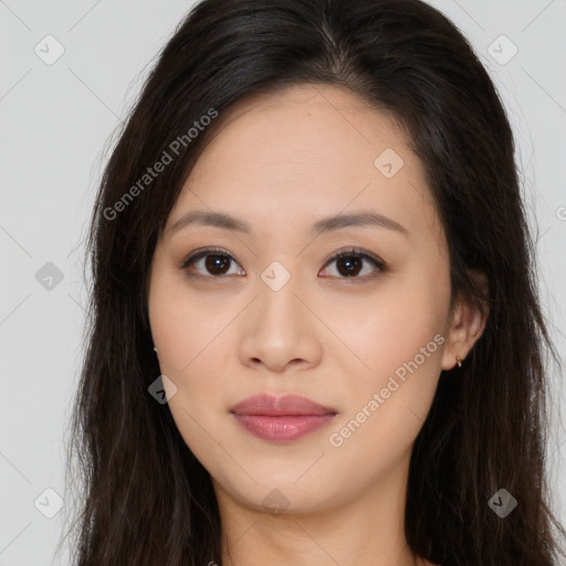 Joyful asian young-adult female with long  brown hair and brown eyes