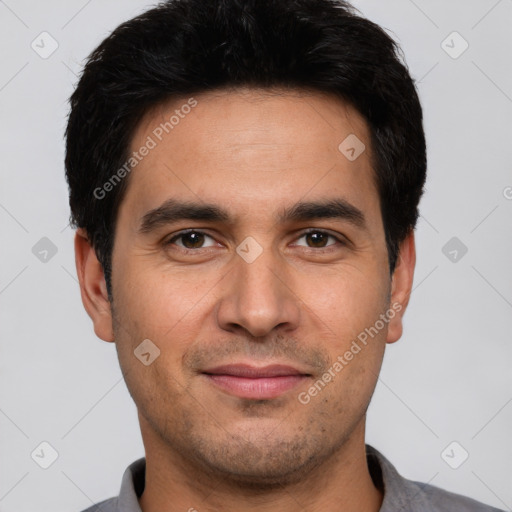 Joyful white young-adult male with short  black hair and brown eyes