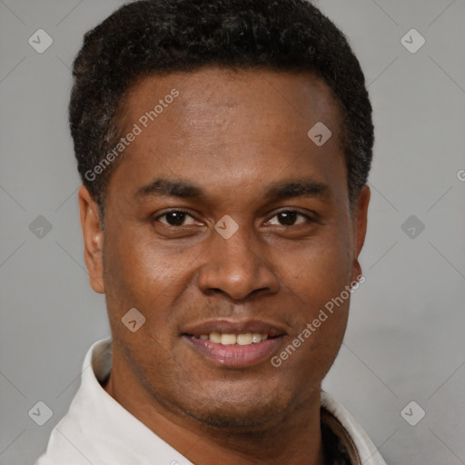 Joyful black young-adult male with short  brown hair and brown eyes