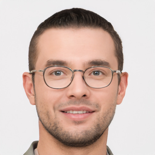 Joyful white young-adult male with short  brown hair and brown eyes