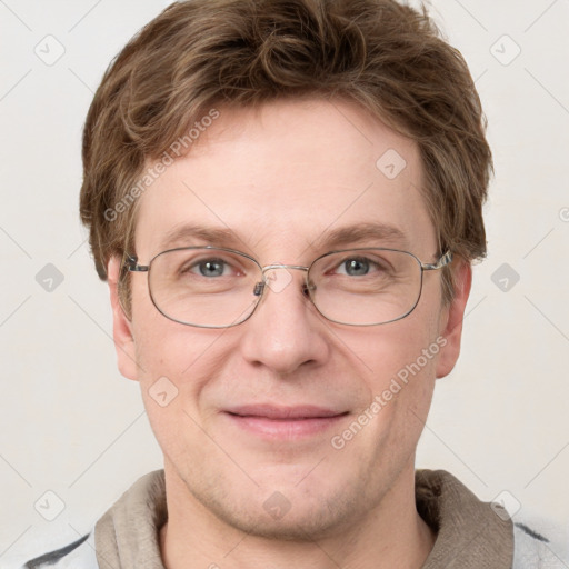 Joyful white adult male with short  brown hair and grey eyes