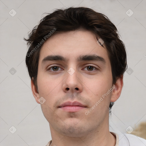 Neutral white young-adult male with short  brown hair and brown eyes