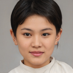 Joyful asian child female with medium  brown hair and brown eyes