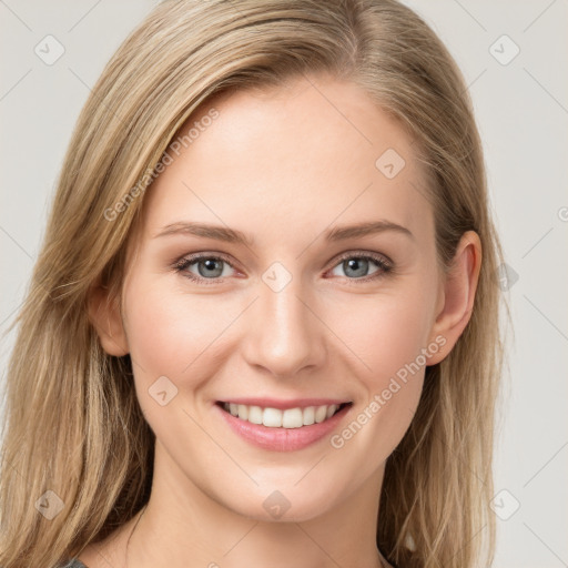 Joyful white young-adult female with long  brown hair and blue eyes