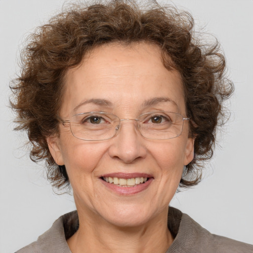 Joyful white middle-aged female with medium  brown hair and brown eyes