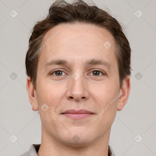 Joyful white adult male with short  brown hair and brown eyes