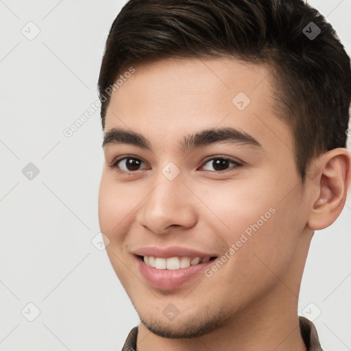 Joyful white young-adult male with short  brown hair and brown eyes