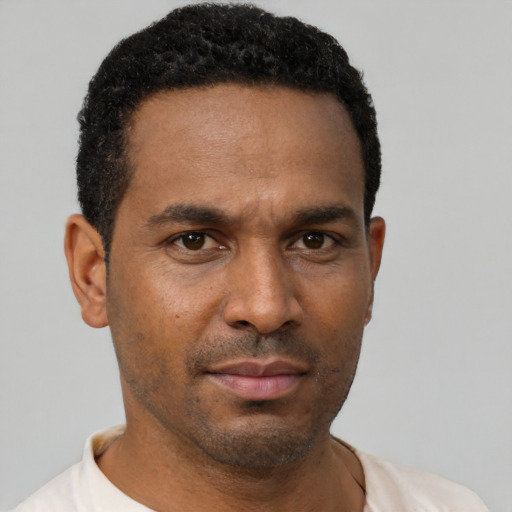 Neutral latino young-adult male with short  brown hair and brown eyes