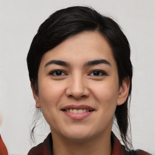 Joyful asian young-adult female with medium  black hair and brown eyes