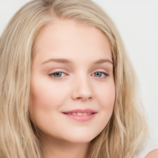 Joyful white young-adult female with long  brown hair and blue eyes