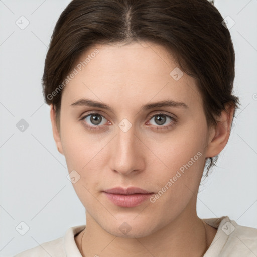 Neutral white young-adult female with short  brown hair and grey eyes