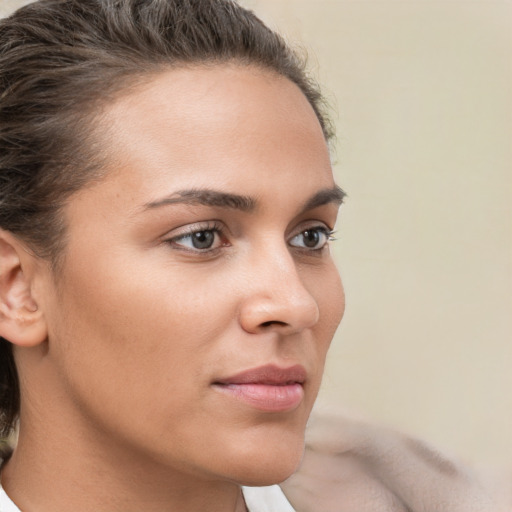 Neutral white young-adult female with short  brown hair and brown eyes